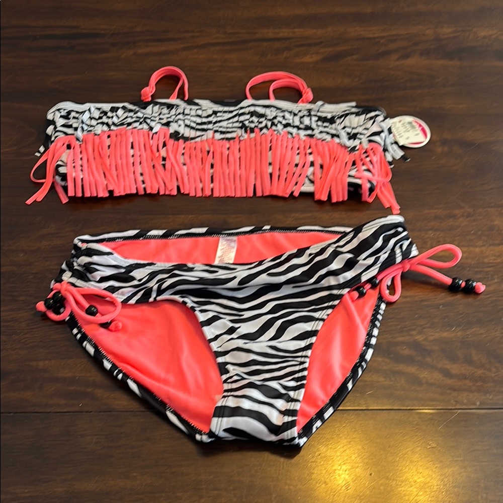 Justice two piece zebra and coral bathing suit. New size 18.
